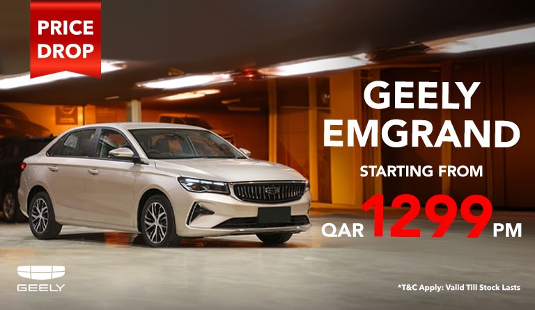 Silver Geely Emgrand sedan in a lit parking garage. Text highlights a price drop, offering the car from QAR 1299 PM. Brand logo at the bottom left.